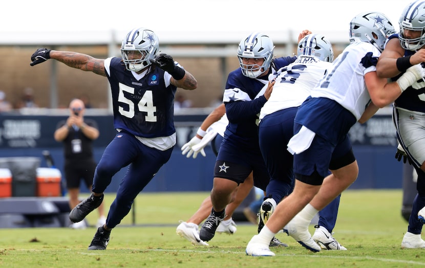 Dallas Cowboys defensive end Sam Williams (54) rushes around the end during a training camp...