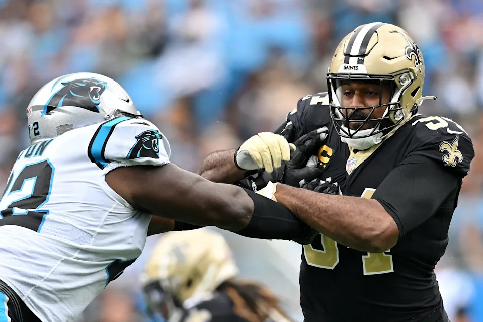 CHARLOTTE, NORTH CAROLINA - SEPTEMBER 25: Cameron Jordan #94 of the New Orleans Saints rushes against Taylor Moton #72 of the Carolina Panthers during the first quarter at Bank of America Stadium on September 25, 2022 in Charlotte, North Carolina. (Photo by Grant Halverson/Getty Images)