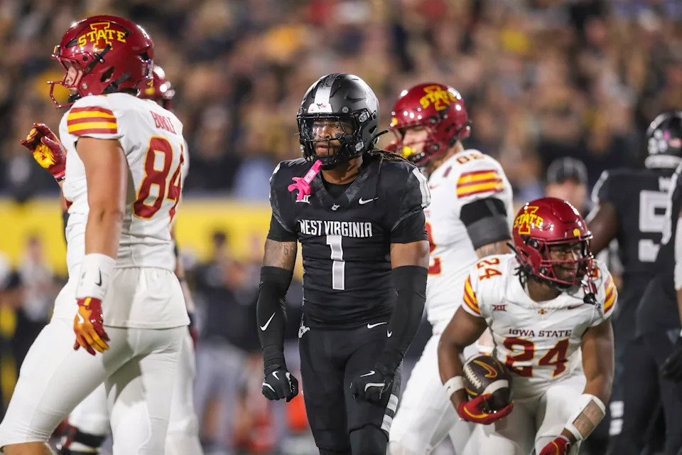 West Virginia cornerback Garnett Hollis Jr. celebrates after a defensive stop against Iowa State.