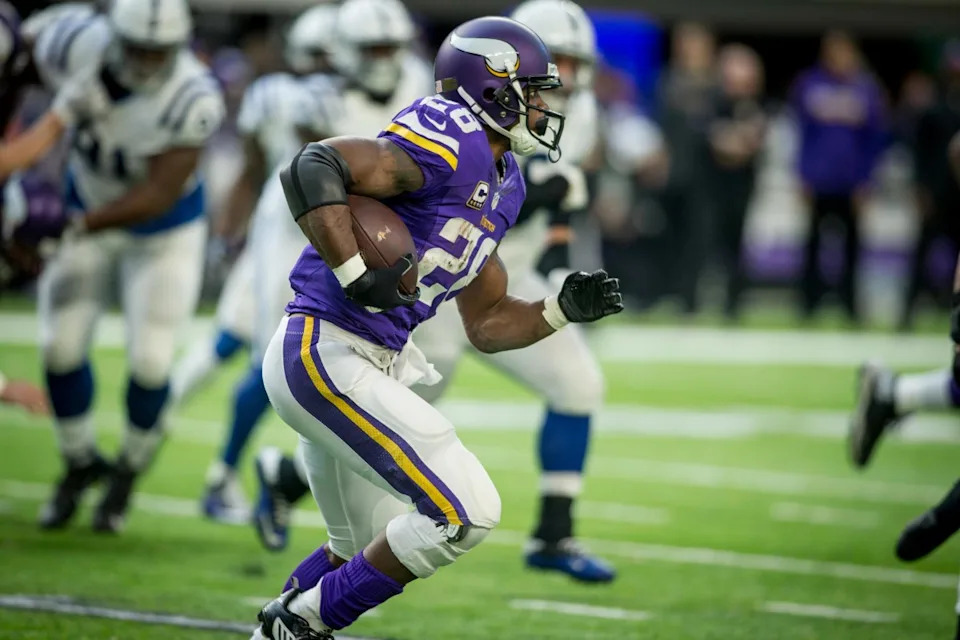 Dec 18, 2016; Minneapolis, MN, USA; Minnesota Vikings running back Adrian Peterson (28) rushes against the Indianapolis Colts in the third quarter at U.S. Bank Stadium. The Colts win 34-6. Mandatory Credit: Bruce Kluckhohn-Imagn Images© Bruce Kluckhohn-Imagn Images