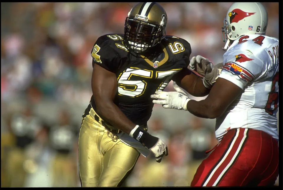 18 Oct 1992: NEW ORLEANS SAINTS LINEBACKER RICKEY JACKSON (LEFT) BATTLES WITH AN UNIDENTIFIED PHOENIX CARDINALS OFFENDER DURING THE SAINTS 30-21 WIN AT SUN DEVIL STADIUM IN TEMPE, ARIZONA