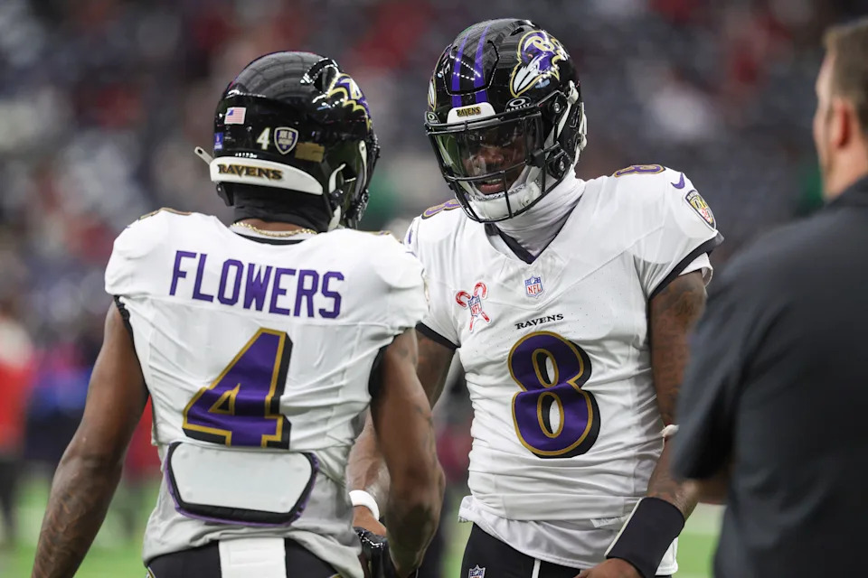 Dec 15, 2024; Houston, Texas, USA; Baltimore Ravens quarterback Lamar Jackson (8) shakes hands with wide receiver Zay Flowers (4) before the game against the Houston Texans at NRG Stadium. Mandatory Credit: Troy Taormina-Imagn Images