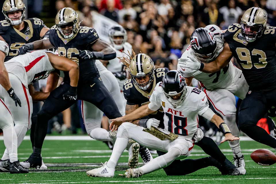 NEW ORLEANS, LOUISIANA - NOVEMBER 10: Payton Turner #98 of the New Orleans Saints forces a fumble by Kirk Cousins during the second half of a game at the Caesars Superdome on November 10, 2024 in New Orleans, Louisiana. (Photo by Derick E. Hingle/Getty Images)