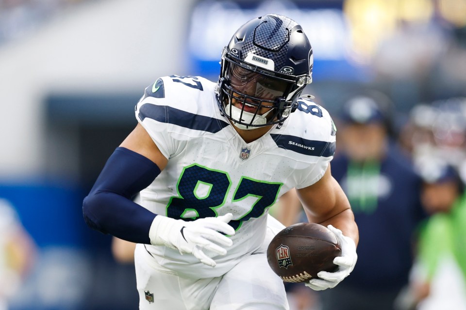 Seattle Seahawks player #87 holding a football.