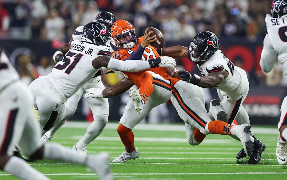 Houston Texans defensive end Will Anderson Jr. (51) and defensive end Danielle Hunter (55) attempt to sack Chicago Bears quarterback Caleb Williams (18)Troy Taormina-Imagn Images