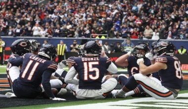 Bears players celebrate after Chicago Bears wide receiver Keenan Allen (13) scored his side's third touchdown during the third quarter of an NFL football game at the Tottenham Hotspur stadium between the Jacksonville Jaguars and Chicago Bears in London, Sunday, Oct. 13, 2024. (AP Photo/Ian Walton)