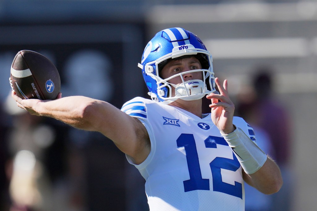 BYU quarterback Jake Retzlaff warming up.