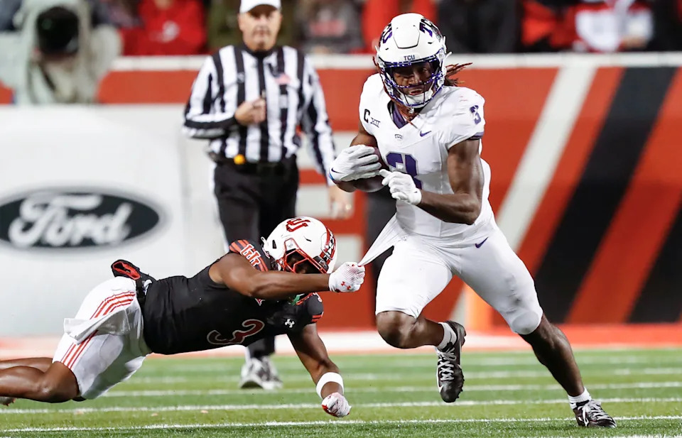 SALT LAKE CITY, UT - OCTOBER 19: Savion Williams #3 of the TCU Horned Frogs breaks a tackle attempt by Jonathan Hall #3 of the Utah Utes during the second half of their game at Rice Eccles Stadium on October 19, 2024 in Salt Lake City, Utah.(Photo by Chris Gardner/Getty Images)