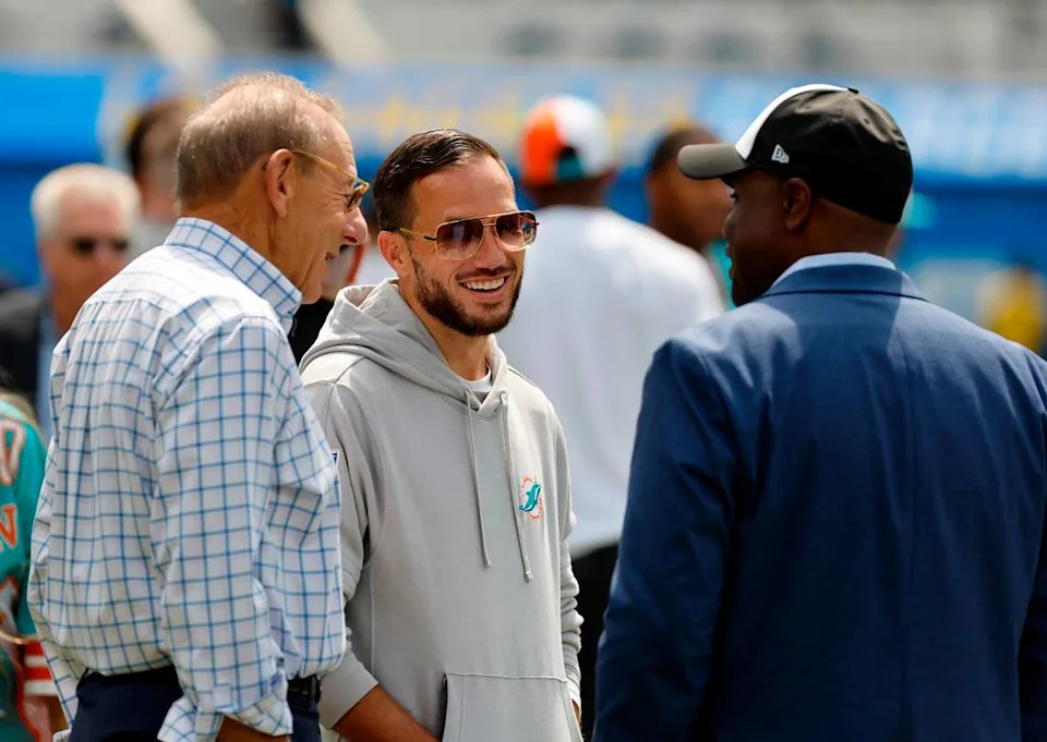 Miami Dolphins head coach Mike McDaniel talks with Dolphins general manager Chris Grier and Dolphins owner Stephen Ross before the start of an NFL football game against Los Angeles Chargers at SoFi Stadium in Inglewood, California on Sunday, September 10, 2023. By Al Diaz