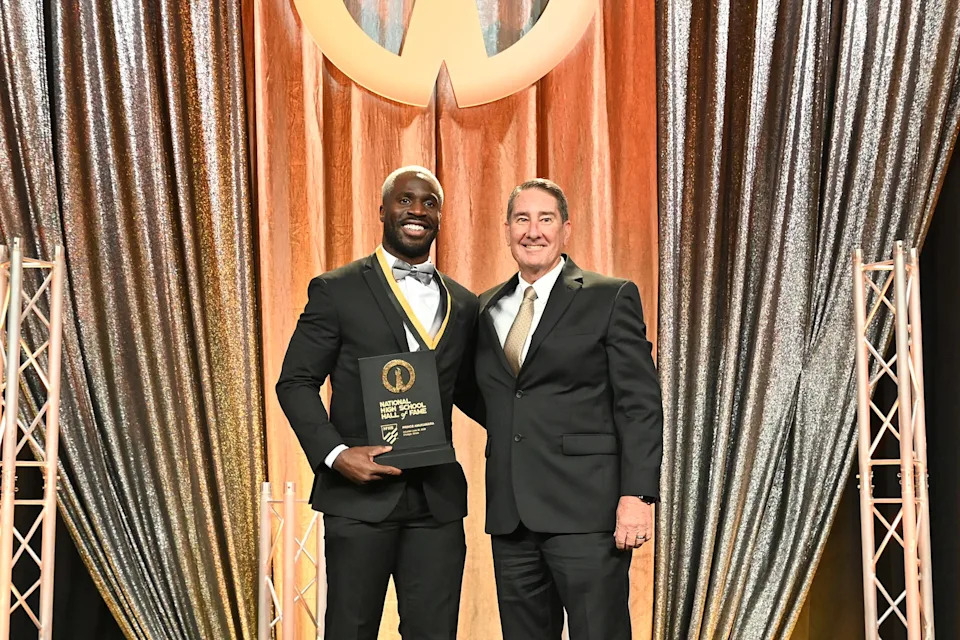 Former Apollo High great Prince Amukamara was among 11 people inducted into the NFHS National High School Hall of Fame in Chicago on June 30, 2025. Former AIA executive director David Hines (right) introduced Amukamara at the ceremony.