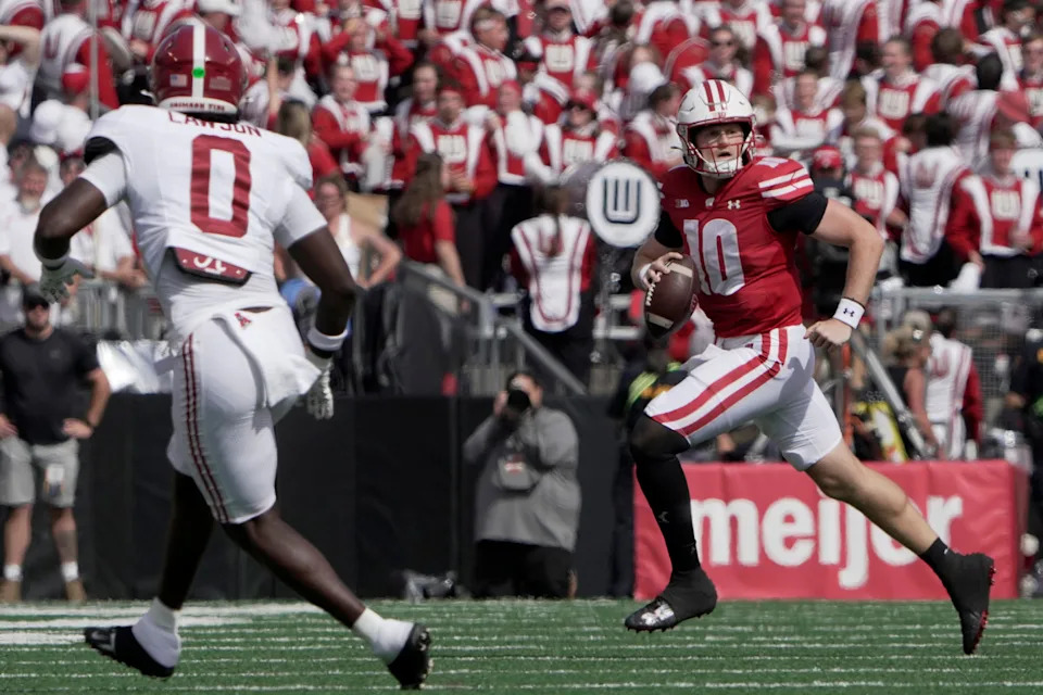 Sep 14, 2024; Madison, Wisconsin, USA; Wisconsin Bulldogs quarterback Tyler Van Dyke (10) scrambles against the Alabama Crimson Tide during the first quarter at Camp Randall Stadium. Mandatory Credit: Mark Hoffman/USA TODAY Network via Imagn Images