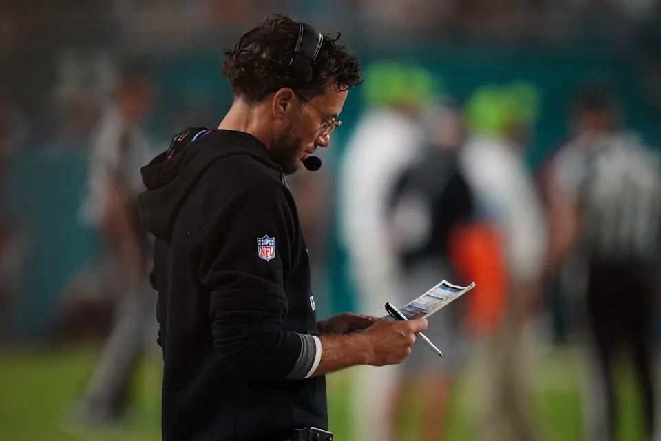 Miami Dolphins head coach Mike McDaniel looks over his play card during the second half against the Tennessee Titans at Hard Rock Stadium.© Jasen Vinlove-Imagn Images