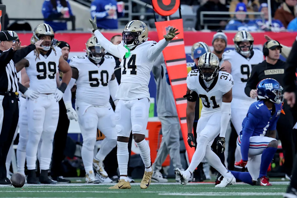 Dec 8, 2024; East Rutherford, New Jersey, USA; New Orleans Saints cornerback Kool-Aid McKinstry (14) reacts after breaking up a pass intended for New York Giants wide receiver Malik Nabers (1) during the second quarter at MetLife Stadium. Mandatory Credit: Brad Penner-Imagn Images