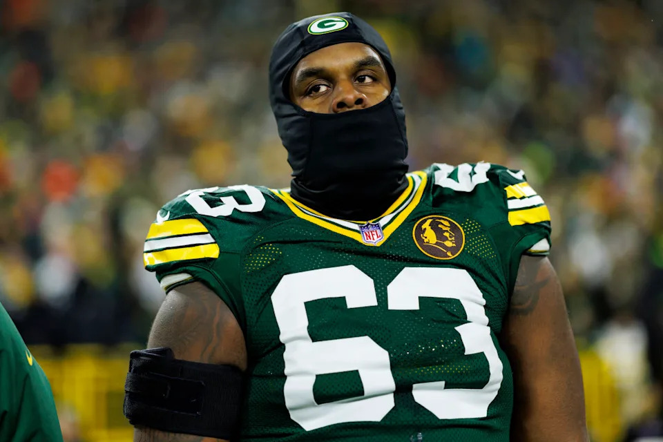 GREEN BAY, WISCONSIN - NOVEMBER 28: Offensive tackle Rasheed Walker #63 of the Green Bay Packers stands on the sidelines during the national anthem prior to an NFL game against the Miami Dolphins at Lambeau Field on November 28, 2024 in Green Bay, Wisconsin. (Photo by Brooke Sutton/Getty Images)