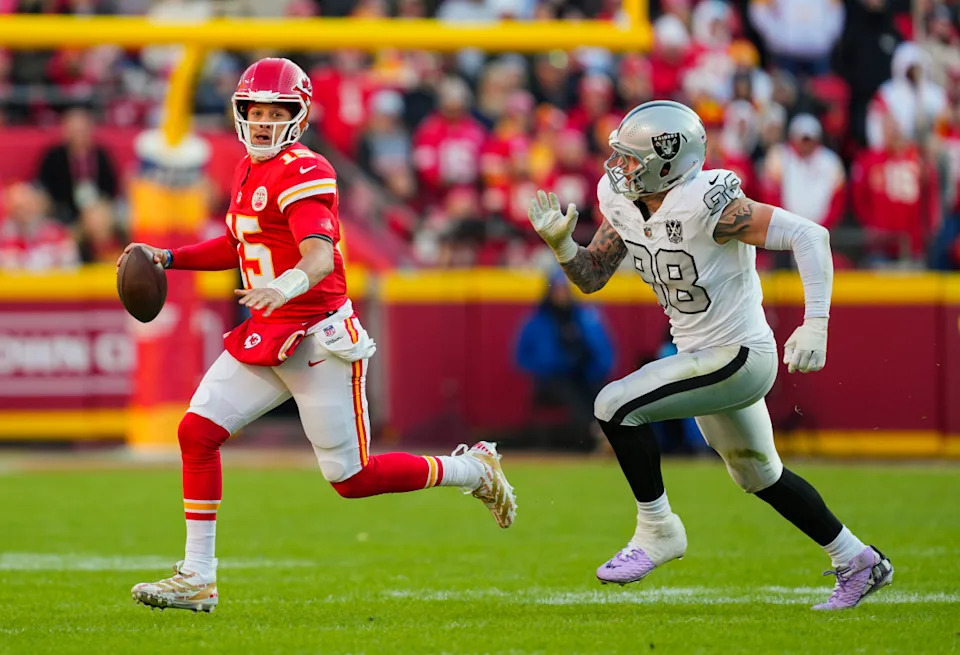 Kansas City Chiefs QB Patrick Mahomes (15) and Las Vegas Raiders DE Maxx Crosby (98).Jay Biggerstaff-Imagn Images