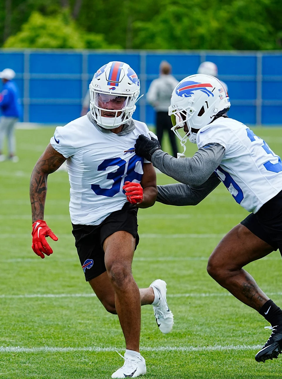 Buffalo Bills Daryl Porter Jr. runs past Cam Lewis during a drill at their practice facility on May 27, 2025.