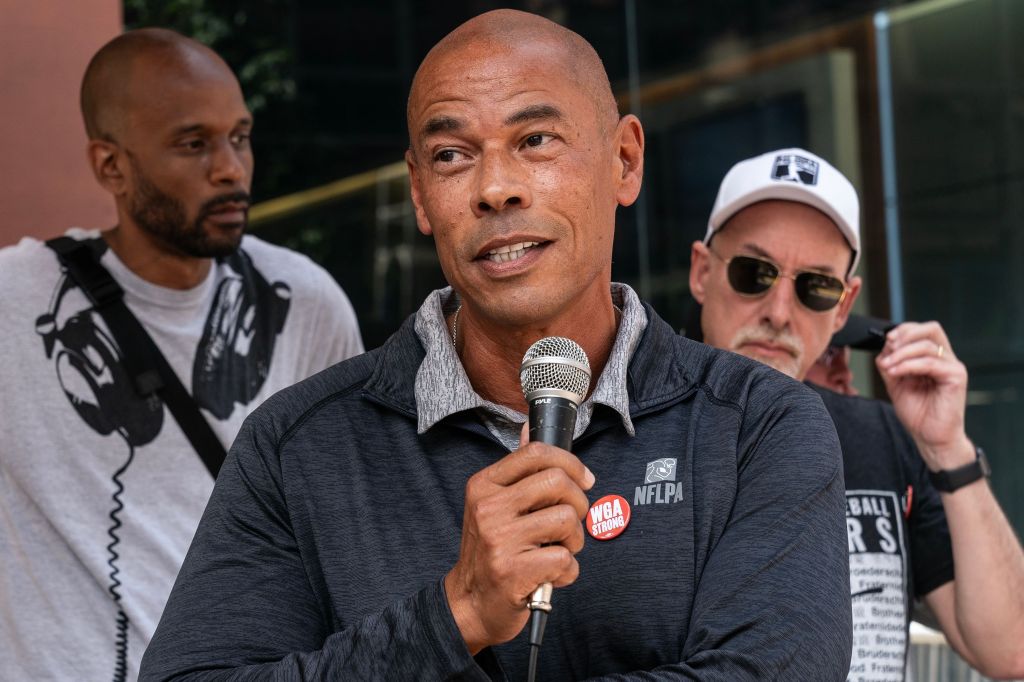 Lloyd Howell, Executive Director of the NFL Players Association, speaks at a Writers Guild of America picket.