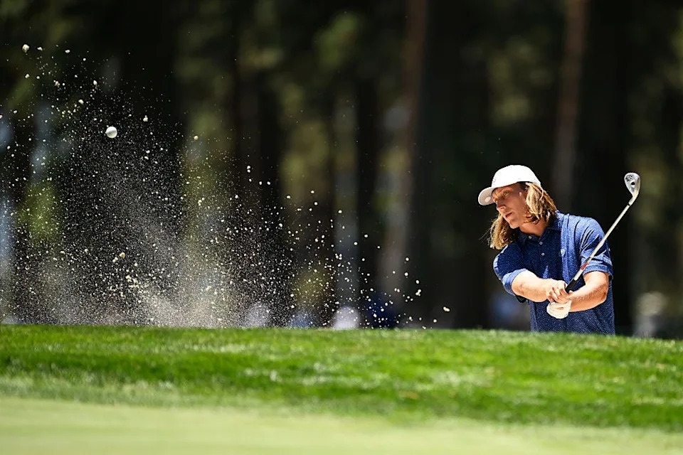 Jacksonville Jaguars quarterback Trevor Lawrence hits out of a bunker at the 15th hole of the Edgewood Tahoe Golf Course in Stateline, Nev., on July 11 during the first round of the American Century Championship.