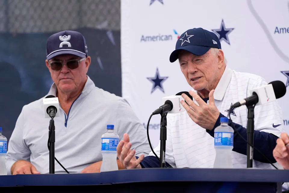 Jerry Jones, right, Dallas Cowboys owner, president, and general manager speaks to reporters as Stephen Jones, Cowboys co-owner, executive vice president, CEO, and director of player personnel listen during a news conference to open training camp Monday, July 21, 2025, in Oxnard, Calif. (AP Photo/Mark J. Terrill)