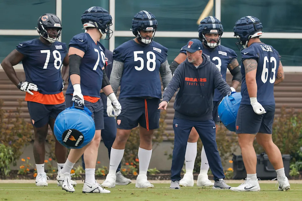 LAKE FOREST, ILLINOIS - JUNE 04: Offensive line coach Dan Roushar gives instructions to Joshua Miles #78, Theo Benedet #79, Darnell Wright #58, Jonah Jackson #73 and Chris Glaser #63 during Chicago Bears OTA Offseason Workout at Halas Hall on June 04, 2025 in Lake Forest, Illinois. (Photo by Michael Reaves/Getty Images)