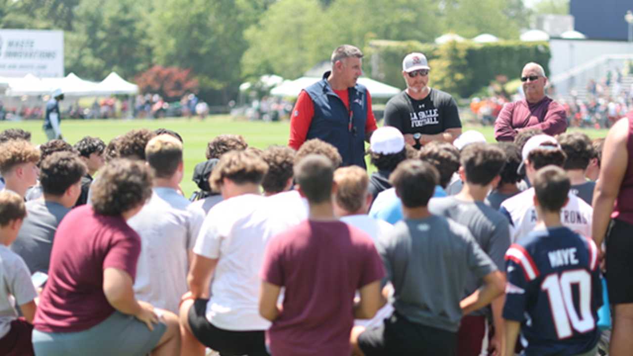 Mike Vrabel offers encouragement to La Salle Academy football team and their head coach, former Patriots center Dan Koppen