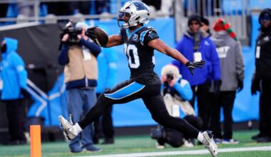 Carolina Panthers running back Chuba Hubbard scores the winning touchdown against the Arizona Cardinals during overtime in an NFL football game Sunday, Dec. 22, 2024, in Charlotte, N.C. (AP Photo/Rusty Jones)
