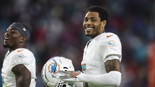 Steelers CB Jalen Ramsey smiling on the sidelines while a member of the Miami Dolphins