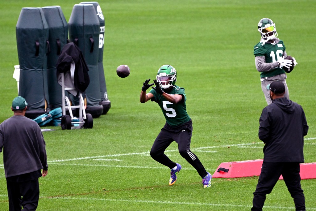 New York Jets wide receiver Garrett Wilson (5) catching a football during practice.