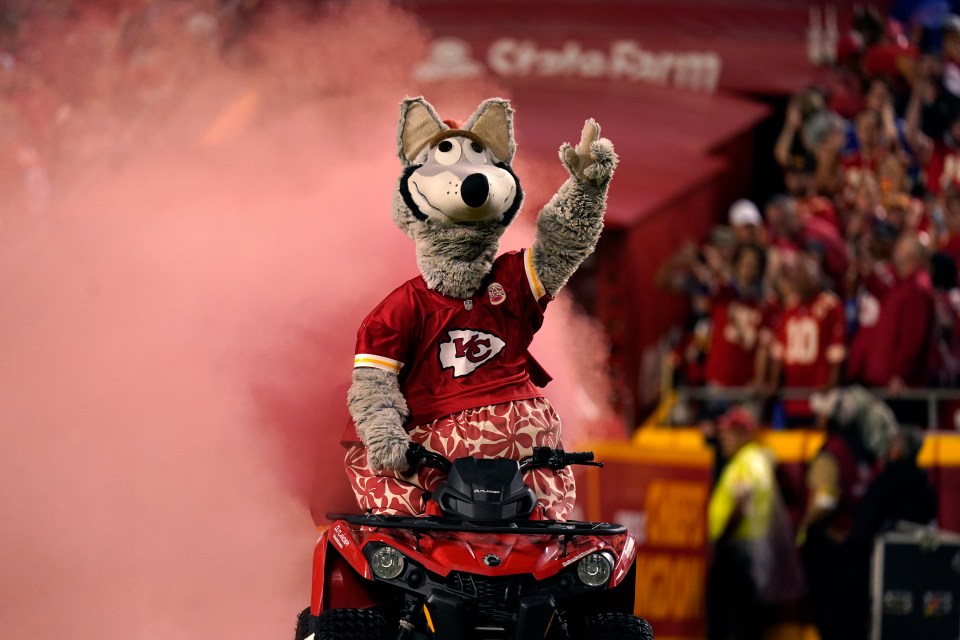 KC Wolf, the Kansas City Chiefs mascot, waves from an ATV.