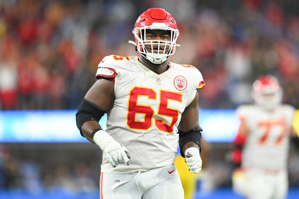 Kansas City Chiefs offensive lineman Trey Smith (#65) on the field.