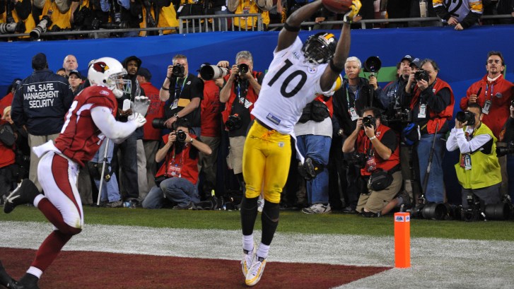 Santonio Holmes with Super Bowl for Pittsburgh Steelers