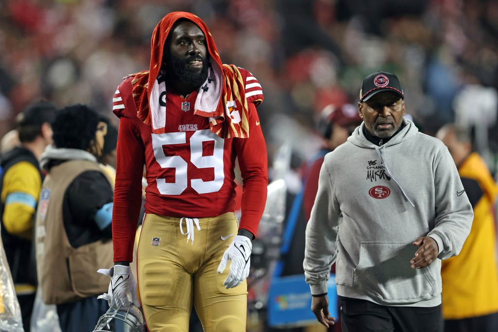 De'Vondre Campbell walks to the locker room during the second half against the Los Angeles Rams.