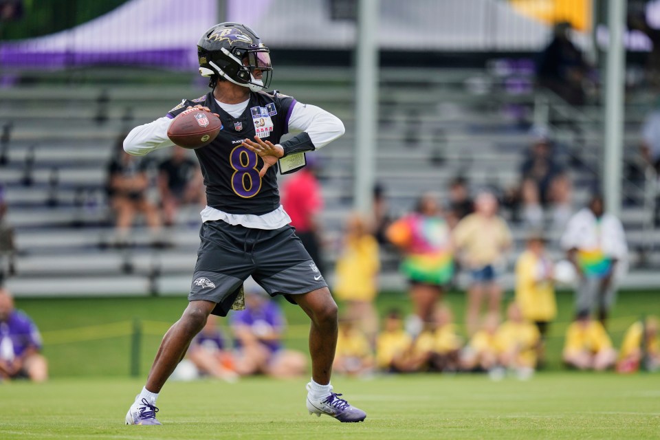 Lamar Jackson throwing a football at practice.