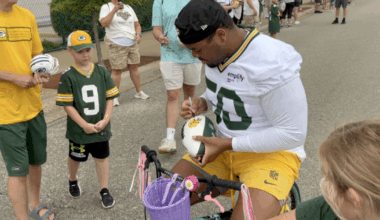 Young fans excited to share bike rides with Packers players at training camp