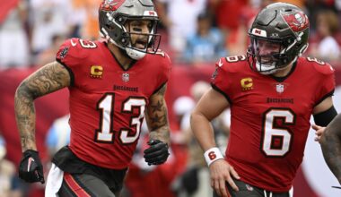 Mayfield throws 5 TD passes and Bucs keep playoff, NFC South hopes alive with 48-14 rout of Panthers