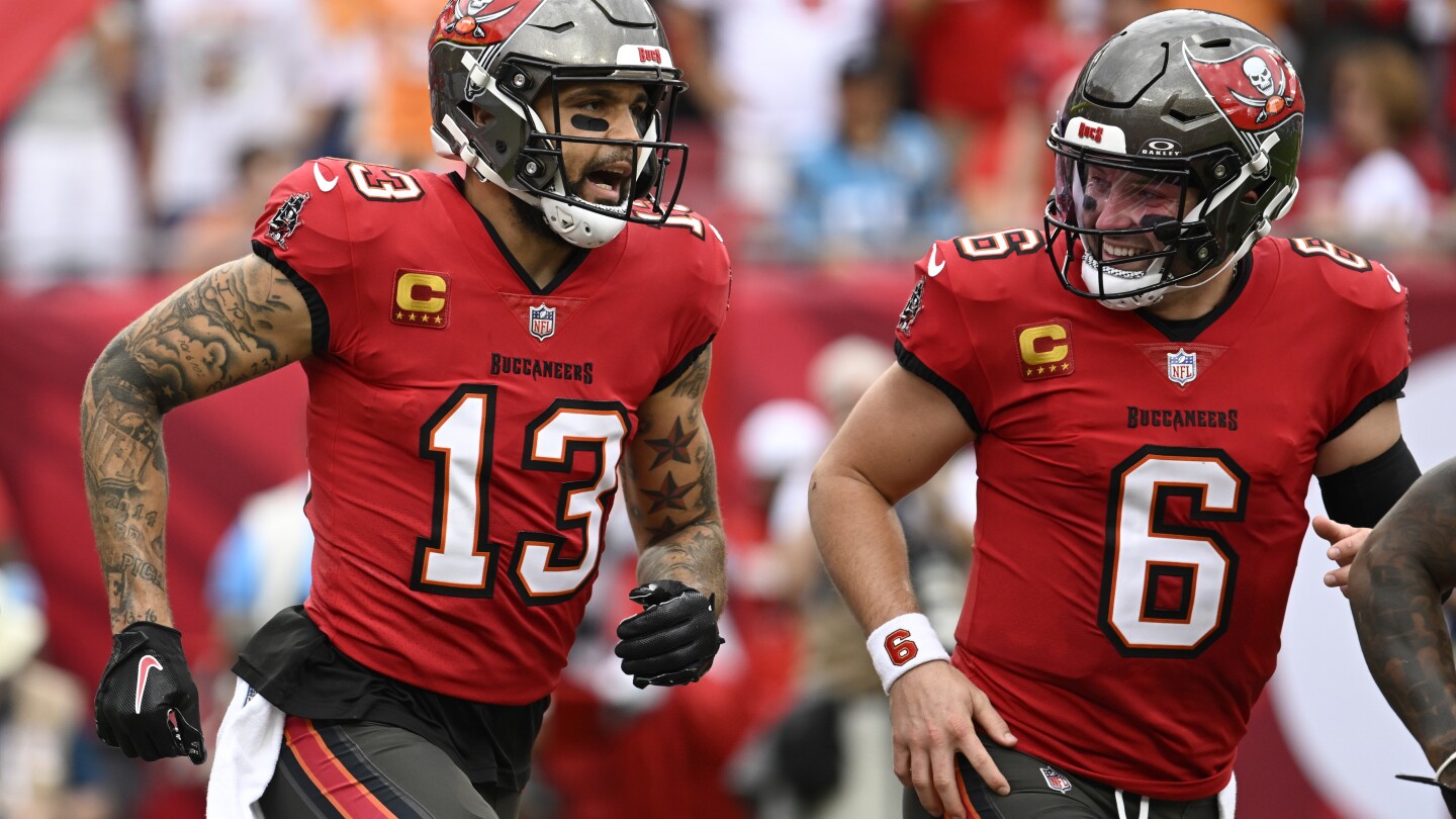 Mayfield throws 5 TD passes and Bucs keep playoff, NFC South hopes alive with 48-14 rout of Panthers