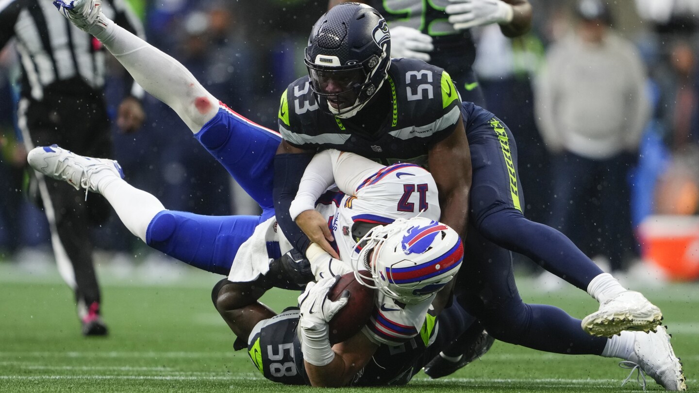 Seahawks teammates Derick Hall and Jarran Reed separated on sideline during loss to Bills