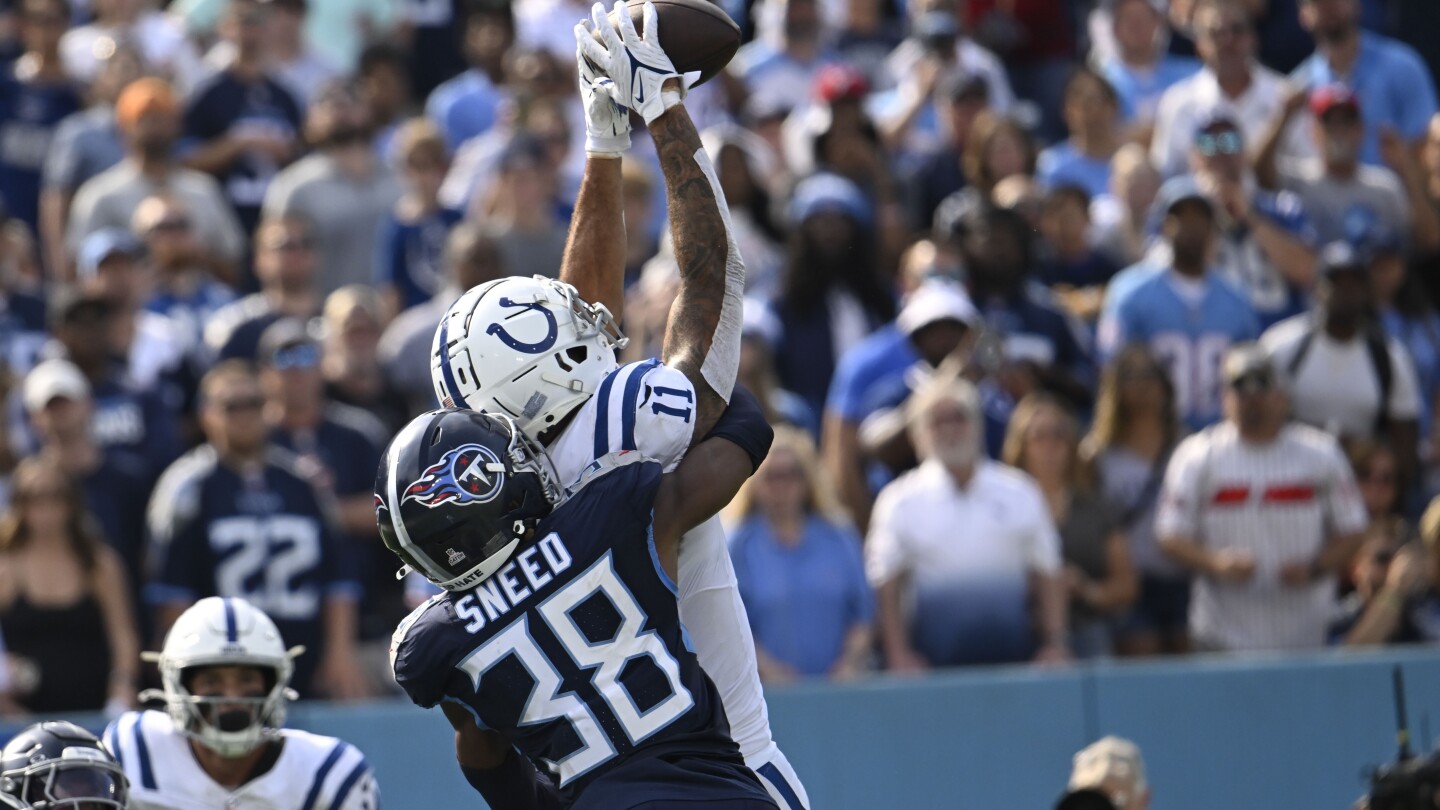 Joe Flacco throws two TD passes as the battered Colts beat the Titans 20-17