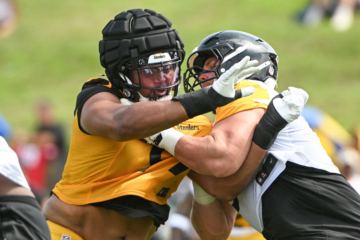 Pittsburgh Steelers defensive tackle Derrick Harmon (99) battles center Zach Frazier (54) during drills during training camp at Saint Vincent College. 