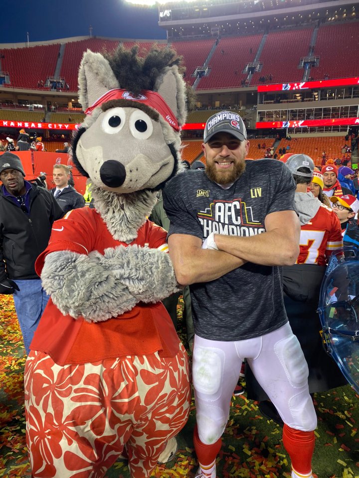 Travis Kelce with the Kansas City Wolf mascot.