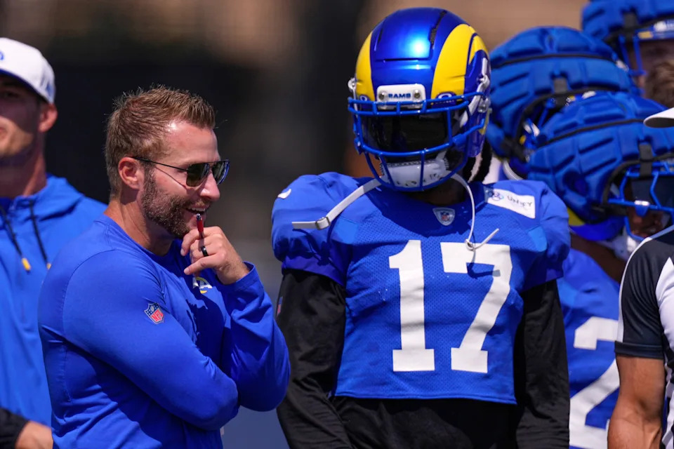 Los Angeles Rams head coach Sean McVay, left, talks with wide receiver Davante Adams during a training camp scrimmage against the Dallas Cowboys, Tuesday, Aug. 5, 2025, in Oxnard, Calif. (AP Photo/Mark J. Terrill)
