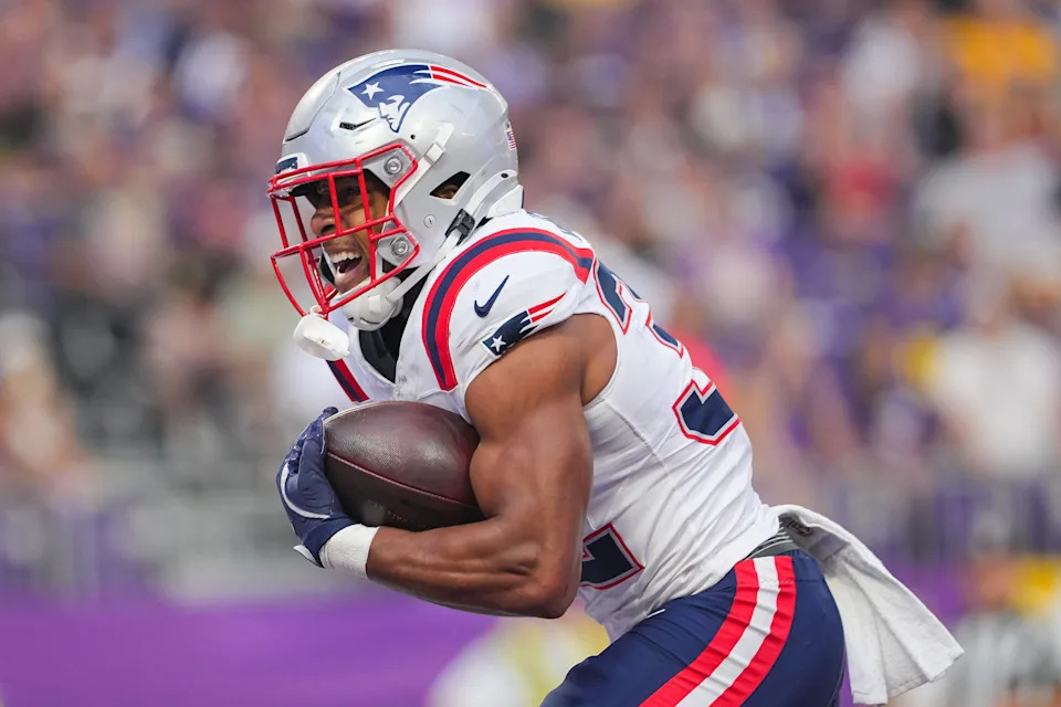 Aug 16, 2025; Minneapolis, Minnesota, USA; New England Patriots running back TreVeyon Henderson (32) celebrates his touchdown against the Minnesota Vikings in the first quarter at U.S. Bank Stadium. Mandatory Credit: Brad Rempel-Imagn Images
