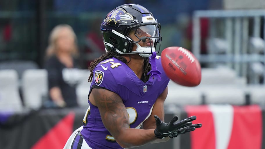 Baltimore Ravens running back Keaton Mitchell (34) warms up prior to a preseason game.