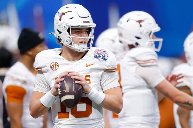 Arch Manning #16 of the Texas Longhorns warms up prior to the Chick-fil-A Peach Bowl against the Arizona State Sun Devils at Mercedes-Benz Stadium on January 01, 2025 in Atlanta, Georgia.