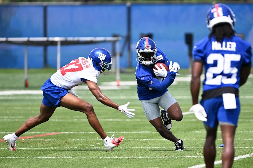 Giants wide receiver Montrell Washington (80) gets by cornerback Tre Hawkins III (37) at practice during OTA’s in East Rutherford, N.J. Bill Kostroun/New York Post