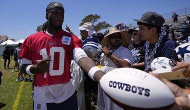 Cowboys quarterback Joe Milton III signs autographs during training camp
