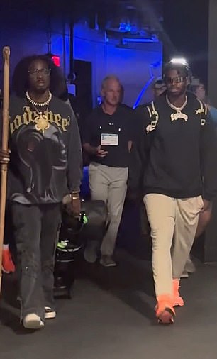 Before the game, Sanders arrived into the stadium with his entourage