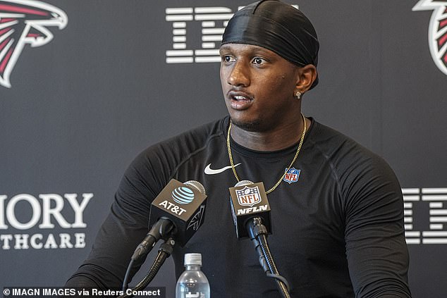 Kirk Cousins is behind Michael Penix Jr. (pictured) on the depth chart in Atlanta