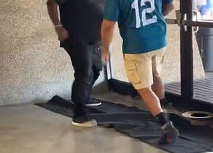 Two football fans were seen brawling at the preseason game between the Saints and Jaguars