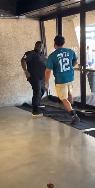 Two football fans were seen brawling at the preseason game between the Saints and Jaguars